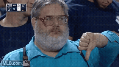 A Man With A Beard And Glasses Is Giving A Thumbs Down Sign GIF