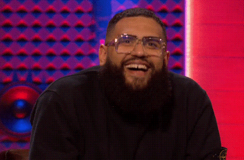 A Man With A Beard And Glasses Is Giving A Thumbs Up GIF