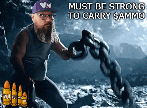 A Man With A Beard And Glasses Is Holding A Chain With The Words " Must Be Strong To Carry $ Ammo " GIF