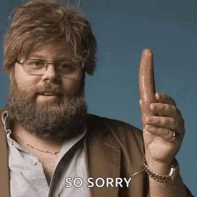 A Man With A Beard And Glasses Is Holding A Sausage In His Hand And Says So Sorry . GIF