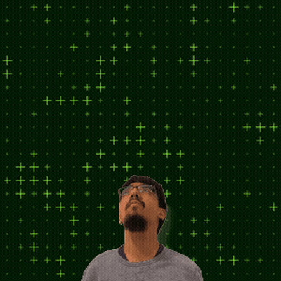 A Man With A Beard And Glasses Is Looking Up At A Glowing Number 20 GIF