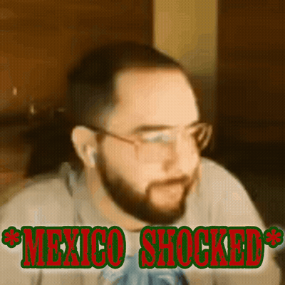 A Man With A Beard And Glasses Is Shocked By Something GIF