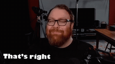 a man with a beard and glasses is smiling and saying that 's right