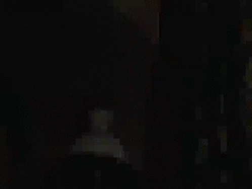 A Man With A Beard And Glasses Is Wearing A Hat And Tie GIF