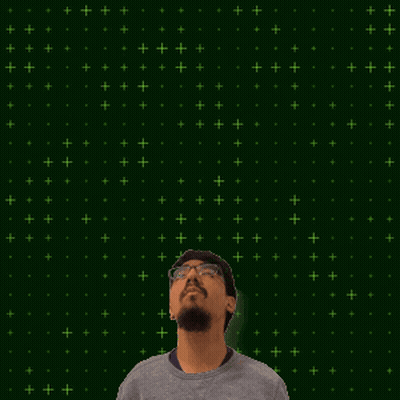 A Man With A Beard And Glasses Looks Up At A Glowing Number 15 GIF