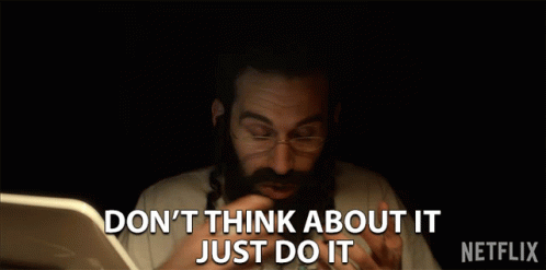A Man With A Beard And Glasses Says " Don 'T Think About It Just Do It " In Front Of A Laptop GIF