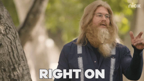A Man With A Beard And Glasses Says Right On In Front Of A Tree GIF