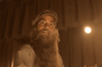 A Man With A Beard And Hat Is Looking Up GIF