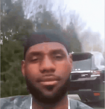 A Man With A Beard And Hat Is Making A Funny Face . GIF