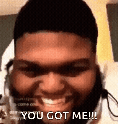 A Man With A Beard And Headphones Is Smiling And Saying `` You Got Me '' . GIF