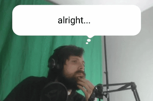 A Man With A Beard And Headphones Says Alright GIF