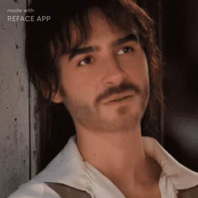 A Man With A Beard And Long Hair Is Being Made With Reface App GIF