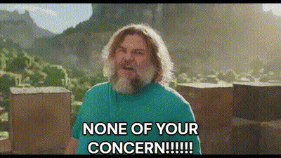 A Man With A Beard And Long Hair Is Standing In Front Of A Mountain And Says None Of Your Concern . GIF