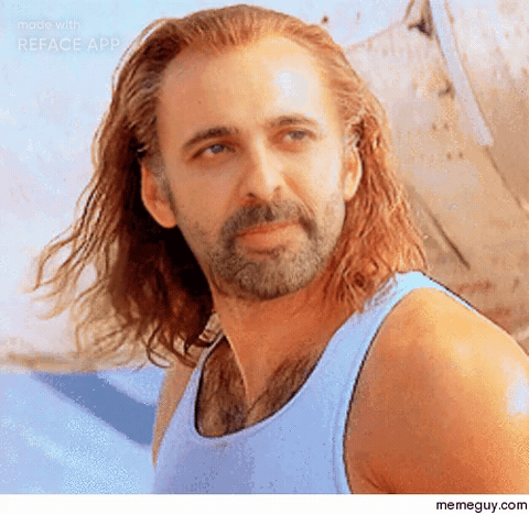A Man With A Beard And Long Hair Is Wearing A Blue Tank Top . GIF