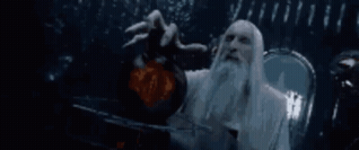 A Man With A Beard And Long White Hair Is Holding A Sphere In His Hand . GIF