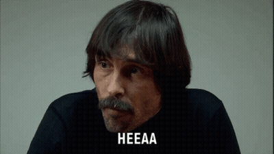 A Man With A Beard And Mustache Has The Word Heeaa On His Face GIF