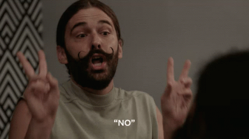 A Man With A Beard And Mustache Is Making A Peace Sign And Says " No " In White Letters GIF
