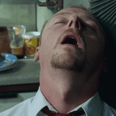 A Man With A Beard And Mustache Is Sleeping With His Mouth Open GIF