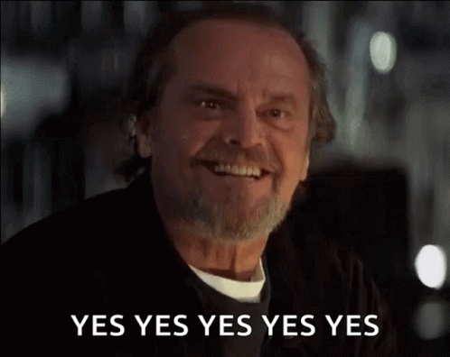 A Man With A Beard And Mustache Is Smiling And Saying Yes Yes Yes Yes Yes . GIF