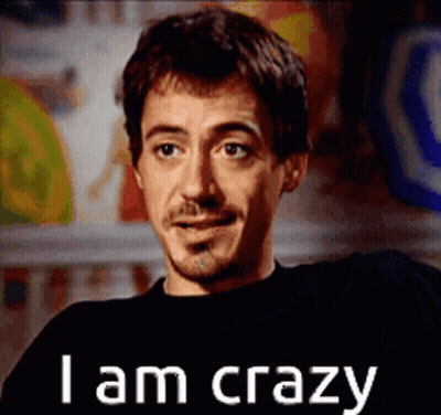 A Man With A Beard And Mustache Is Smiling And Says I Am Crazy GIF
