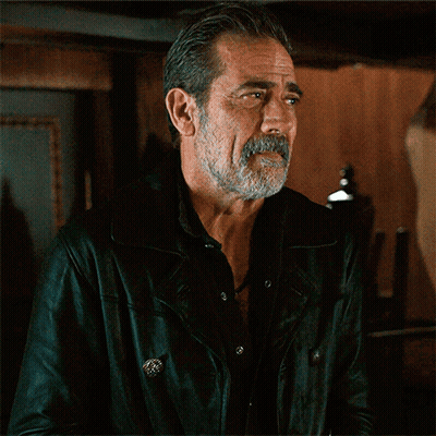 A Man With A Beard And Mustache Is Wearing A Black Jacket GIF