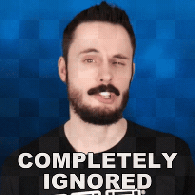 A Man With A Beard And Mustache Is Wearing A Black Shirt That Says Completely Ignored GIF
