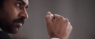 A Man With A Beard And Mustache Is Wearing A White Shirt And A Black Suit GIF