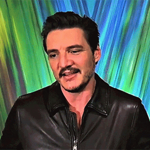 A Man With A Beard And Mustache Wearing A Black Leather Jacket . GIF