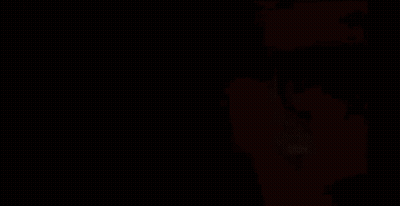 A Man With A Beard And Sunglasses Is Standing In Front Of A Red Sign . GIF