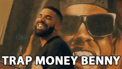 A Man With A Beard And Sunglasses Says " Trap Money Benny " In Front Of A Painting GIF