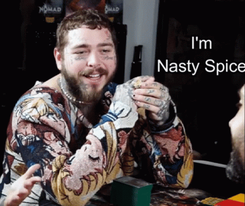 A Man With A Beard And Tattoos Is Smiling With The Words I 'M Nasty Spice Below Him GIF