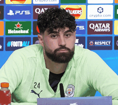 A Man With A Beard And The Number 24 On His Jacket GIF