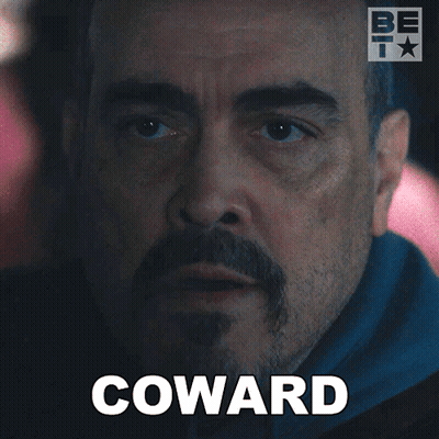 A Man With A Beard And The Word Coward Written On His Face GIF