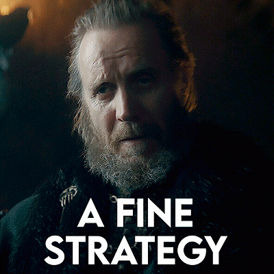 A Man With A Beard And The Words " A Fine Strategy " Behind Him GIF