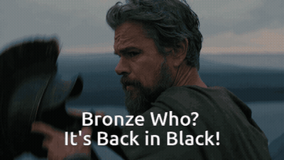 A Man With A Beard And The Words Bronze Who It 'S Back In Black Below Him GIF