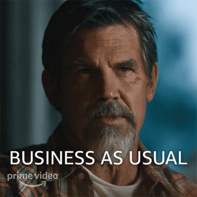 A Man With A Beard And The Words Business As Usual Behind Him GIF
