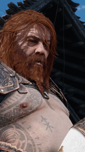 A Man With A Beard Has A Tattoo On His Chest That Says X GIF