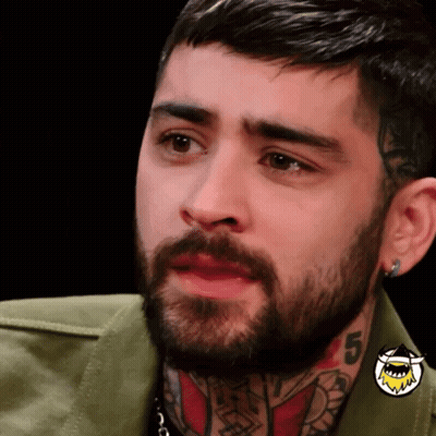 A Man With A Beard Has A Tattoo On His Neck With The Number 5 GIF
