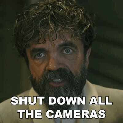 A Man With A Beard Has The Words Shut Down All The Cameras On His Face GIF