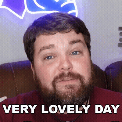 A Man With A Beard Has The Words Very Lovely Day Below His Face GIF
