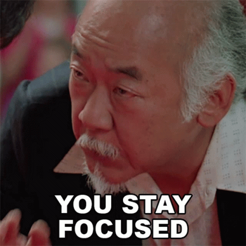 A Man With A Beard Has The Words You Stay Focused On His Face GIF