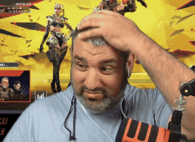 A Man With A Beard Holds His Hand To His Forehead In Front Of A Screen That Says Legends GIF