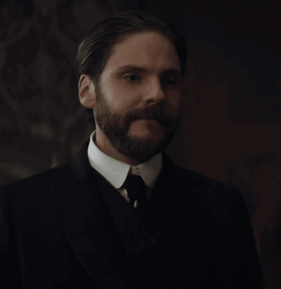 A Man With A Beard In A Suit And Tie GIF