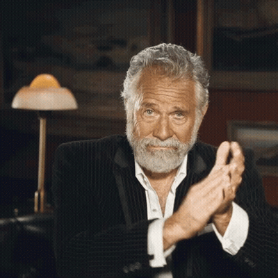 A Man With A Beard In A Suit Is Clapping His Hands GIF