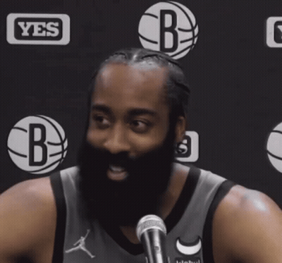 A Man With A Beard In Front Of A Yes Logo GIF