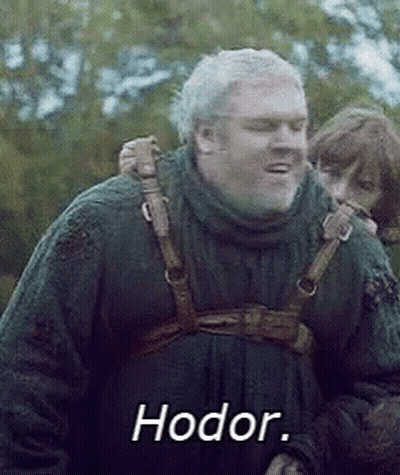 A Man With A Beard Is Carrying A Child On His Back And The Word Hodor Is On The Screen . GIF