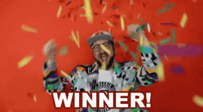 A Man With A Beard Is Celebrating With Confetti And The Words Winner Written On The Bottom GIF