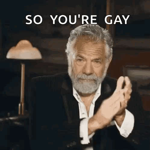 A Man With A Beard Is Clapping His Hands With The Words So You 'Re Gay Behind Him GIF