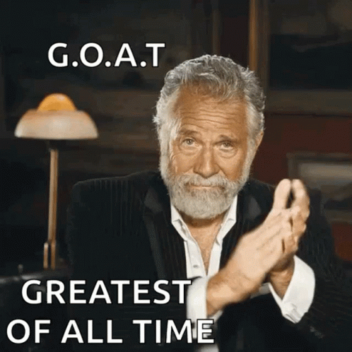 a man with a beard is clapping with the words goat greatest of all time above him