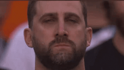 A Man With A Beard Is Crying With His Eyes Closed And A Tear Coming Out Of His Nose . GIF